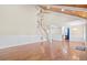 Spacious living room featuring wood floors and a staircase leading to the upper level at 104 Broadmarsh Ct, North Charleston, SC 29418