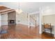 Open-concept living room with fireplace, wood ceiling, built-ins and views to the staircase at 104 Broadmarsh Ct, North Charleston, SC 29418