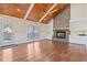 Large living room featuring vaulted wood ceilings, fireplace, built-ins, wood floors and lots of natural light at 104 Broadmarsh Ct, North Charleston, SC 29418