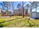 A large, grassy backyard is showcased with a shed and a hammock at 105 Thousand Oaks Cir, Goose Creek, SC 29445