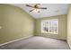 Bedroom with a vaulted ceiling, neutral carpet, a ceiling fan, and a view of the yard at 105 Thousand Oaks Cir, Goose Creek, SC 29445