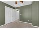 Bedroom with olive-colored walls, carpet, and closet doors at 105 Thousand Oaks Cir, Goose Creek, SC 29445