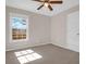 A carpeted bedroom featuring a ceiling fan and a window allowing natural light in at 105 Thousand Oaks Cir, Goose Creek, SC 29445