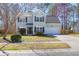 Charming two-story home with light blue siding, black shutters and a well-manicured lawn at 105 Thousand Oaks Cir, Goose Creek, SC 29445