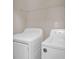 Laundry room with a washer, a dryer, and a storage shelf at 105 Thousand Oaks Cir, Goose Creek, SC 29445
