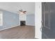 Bright living room with laminate floors, a fireplace, and light blue walls at 105 Thousand Oaks Cir, Goose Creek, SC 29445