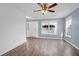 Open living room featuring wood-look floors, many windows and light blue walls at 105 Thousand Oaks Cir, Goose Creek, SC 29445