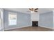 Cozy living room featuring a fireplace, ceiling fan, and soft blue walls at 105 Thousand Oaks Cir, Goose Creek, SC 29445