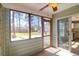 Relaxing screened porch with ceiling fan, sliding door and view of spacious backyard at 105 Thousand Oaks Cir, Goose Creek, SC 29445