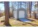 Exterior view of a shed surrounded by trees and grass at 105 Thousand Oaks Cir, Goose Creek, SC 29445