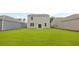 Lush green backyard with slider door, light gray siding, and white trim at 1054 Forrest Creek Dr, Summerville, SC 29483