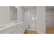A modern bathroom showcases a glass-enclosed shower, dual vanity, and sleek fixtures at 1054 Forrest Creek Dr, Summerville, SC 29483