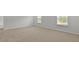 A spacious bedroom features neutral carpeting and bright windows at 1054 Forrest Creek Dr, Summerville, SC 29483