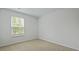 A cozy bedroom featuring neutral carpeting and a bright window at 1054 Forrest Creek Dr, Summerville, SC 29483
