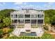 Stunning aerial view of a luxury home with a pool, surrounded by lush greenery and a private oasis at 1126 Ocean Forest Lane, 1/8 Share, Seabrook Island, SC 29455