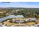 Expansive aerial shot of The Lake House, showcasing its picturesque lakeside setting at 1126 Ocean Forest Lane, 1/8 Share, Seabrook Island, SC 29455