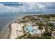 An aerial view of Seabrook Island Beach Club showcasing pools, outdoor lounging, and beautiful ocean access at 1126 Ocean Forest Lane, 1/8 Share, Seabrook Island, SC 29455