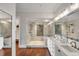 Spa-like bathroom featuring a glass-enclosed shower, soaking tub, and stylish vanity with marble countertop at 1126 Ocean Forest Lane, 1/8 Share, Seabrook Island, SC 29455