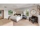 Bright bedroom with a plush bed, stylish decor, and large window, creating a relaxing atmosphere at 1126 Ocean Forest Lane, 1/8 Share, Seabrook Island, SC 29455