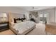 Spacious bedroom with a large bed, stylish decor, and access to a private balcony with scenic views at 1126 Ocean Forest Lane, 1/8 Share, Seabrook Island, SC 29455