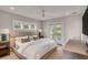 Comfortable bedroom featuring neutral tones, a plush bed, and a private balcony, creating a relaxing space at 1126 Ocean Forest Lane, 1/8 Share, Seabrook Island, SC 29455
