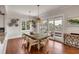 Elegant dining room featuring a wood table, decorative lighting, and sliding glass doors to outdoor area at 1126 Ocean Forest Lane, 1/8 Share, Seabrook Island, SC 29455
