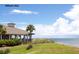 Charming waterfront restaurant with covered patio overlooking the ocean and beautiful sky at 1126 Ocean Forest Lane, 1/8 Share, Seabrook Island, SC 29455