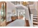 Welcoming foyer with high ceilings, a staircase, and stylish decor, creating an elegant and inviting entry at 1126 Ocean Forest Lane, 1/8 Share, Seabrook Island, SC 29455