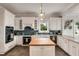 Elegant kitchen with custom cabinets, modern appliances, and a center island, perfect for cooking and entertaining at 1126 Ocean Forest Lane, 1/8 Share, Seabrook Island, SC 29455
