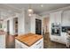 Modern kitchen with a center island, stainless steel appliances, and sleek white cabinetry at 1126 Ocean Forest Lane, 1/8 Share, Seabrook Island, SC 29455
