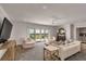 Spacious living room featuring comfortable seating, and sliding doors to a balcony with picturesque marsh views at 1126 Ocean Forest Lane, 1/8 Share, Seabrook Island, SC 29455