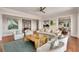 Bright living room with stylish decor, comfortable seating, and a unique wood coffee table at 1126 Ocean Forest Lane, 1/8 Share, Seabrook Island, SC 29455