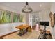 Bright office space with a unique wooden desk, decorative chandelier and exercise equipment at 1126 Ocean Forest Lane, 1/8 Share, Seabrook Island, SC 29455