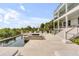 Luxury pool area with a spa and multiple sun loungers, located next to a large multi-level home with balcony at 1126 Ocean Forest Lane, 1/8 Share, Seabrook Island, SC 29455