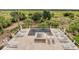 Luxurious pool area featuring sun loungers, umbrellas, and an in-ground spa overlooking a tranquil green space at 1126 Ocean Forest Lane, 1/8 Share, Seabrook Island, SC 29455