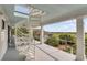 Open air upper level porch with a winding staircase and views of the marshland at 1126 Ocean Forest Lane, 1/8 Share, Seabrook Island, SC 29455