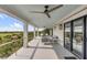 Expansive porch featuring comfortable seating, outdoor ceiling fans, and picturesque views of the marsh at 1126 Ocean Forest Lane, 1/8 Share, Seabrook Island, SC 29455