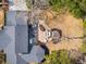 Aerial view of a backyard with a patio, outdoor seating, and a fire pit at 12 Broughton Rd, Charleston, SC 29407