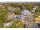 Stunning aerial view showcasing large homes nestled among mature trees in a charming residential neighborhood at 12 Broughton Rd, Charleston, SC 29407