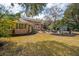 The large backyard boasts a patio, a fire pit, and well-maintained landscaping at 12 Broughton Rd, Charleston, SC 29407