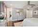 The open plan bedroom features hardwood floors, neutral colored walls, and plenty of light at 12 Broughton Rd, Charleston, SC 29407