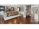 Formal dining room with hardwood flooring, modern chandelier, and seating for ten at 12 Broughton Rd, Charleston, SC 29407