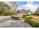 Charming two-story brick home with a two-car garage and a well-manicured lawn at 12 Broughton Rd, Charleston, SC 29407
