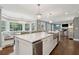 Gourmet kitchen with large island, stainless steel appliances, breakfast nook, and hardwood floors at 12 Broughton Rd, Charleston, SC 29407