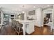 Spacious kitchen with modern island, stainless steel appliances, and hardwood floors at 12 Broughton Rd, Charleston, SC 29407