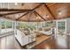 Expansive living room with a wooden ceiling, large windows, and comfortable white sofas at 12 Broughton Rd, Charleston, SC 29407