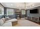 Comfortable living room features stylish lighting, gray walls, and plenty of natural light through the three windows at 12 Broughton Rd, Charleston, SC 29407