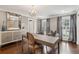 Well-lit office features hardwood floors, decorative mirror and chandelier, with two windows at 12 Broughton Rd, Charleston, SC 29407
