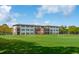 Expansive school building with a large green field and soccer goals, perfect for sports at 12 Broughton Rd, Charleston, SC 29407