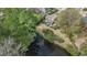 Aerial view of home with lush trees, and access to a lake at 1208 Wynnwood Ct, Mount Pleasant, SC 29464